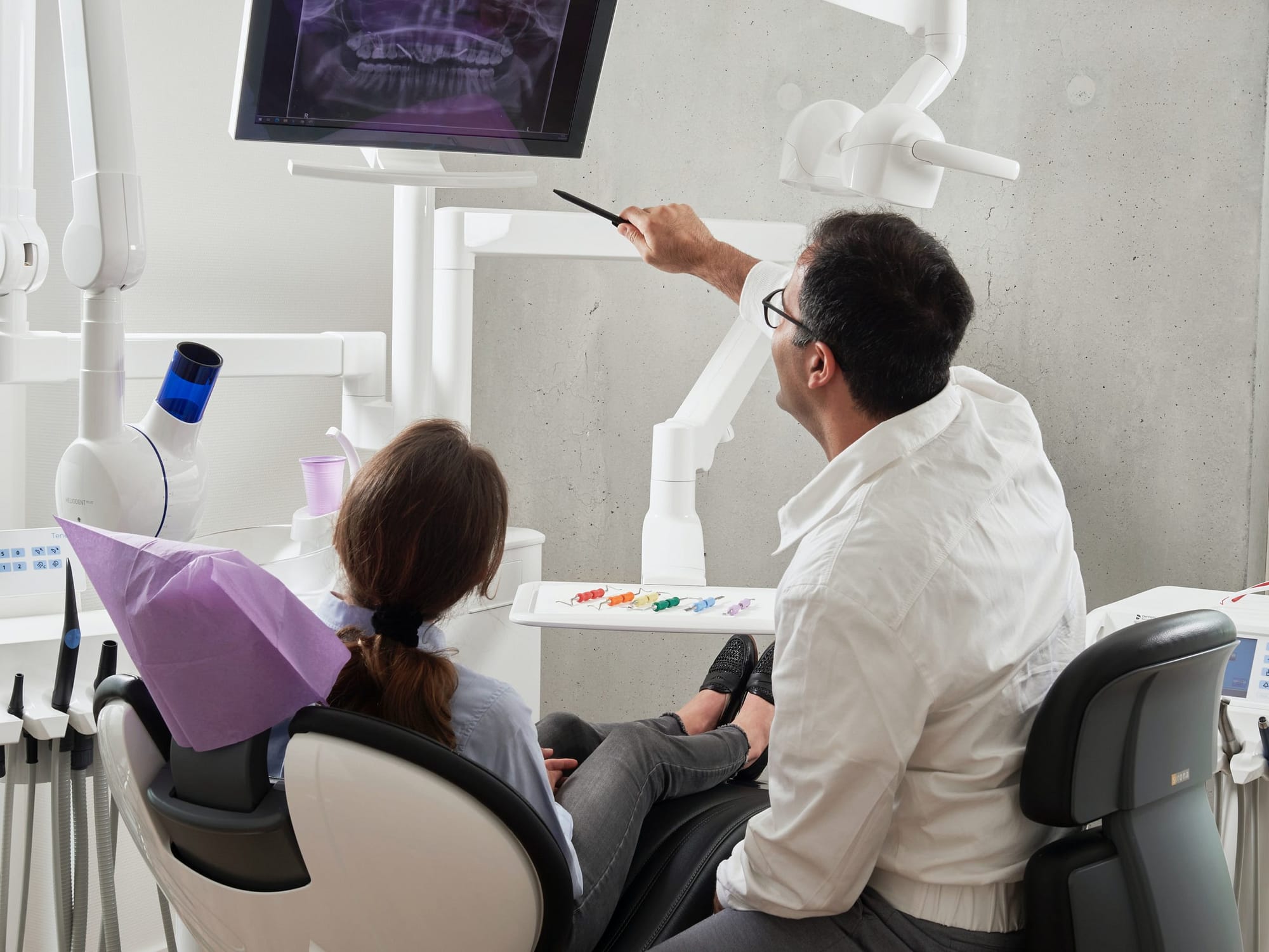 Dentist explaining an xray to patient in office